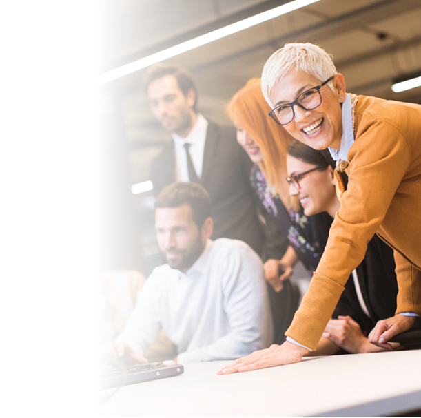 Senior businesswoman working together with young business people in modern office